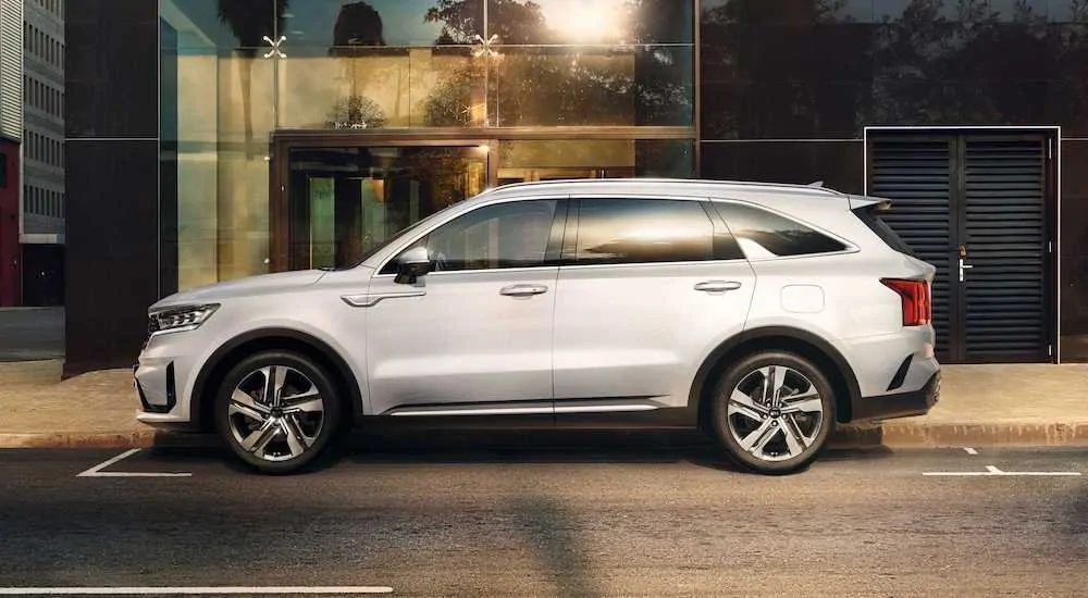 Profile of a white 2021 Kia Sorento parked on a city street