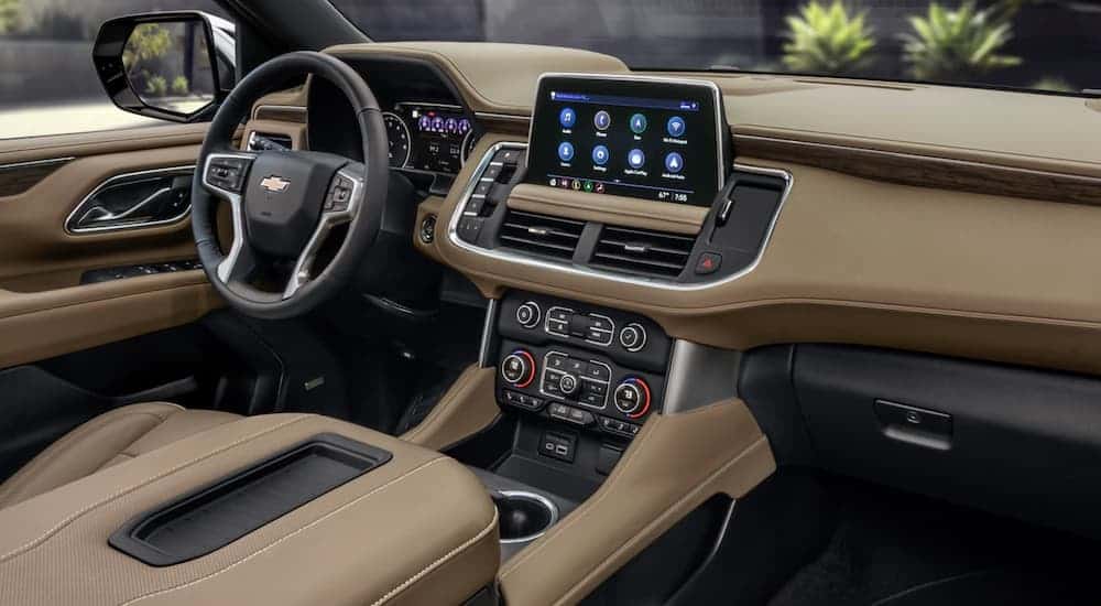 The tan interior of a 2021 Chevy Tahoe is shown.