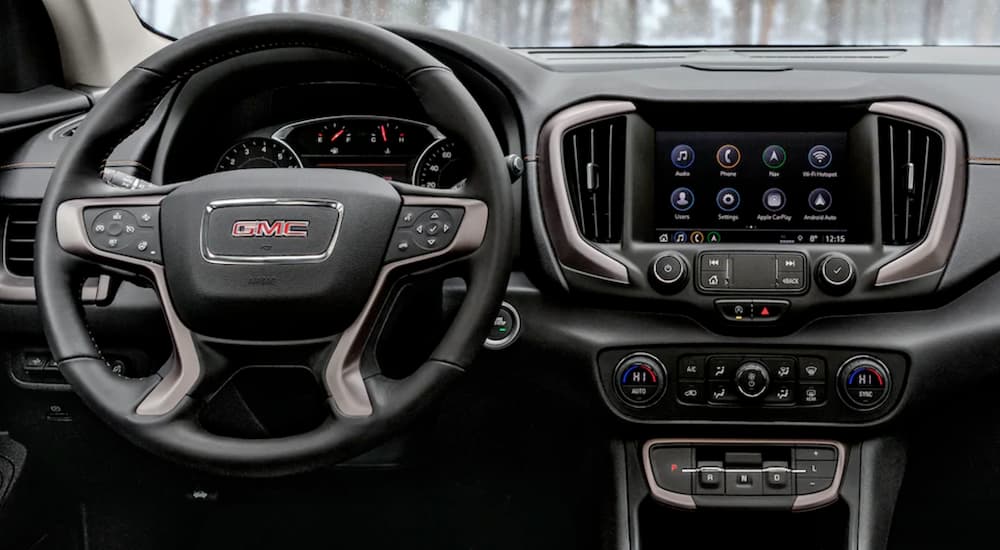 The dashboard and infotainment screen in the 2021 GMC Terrain are shown.