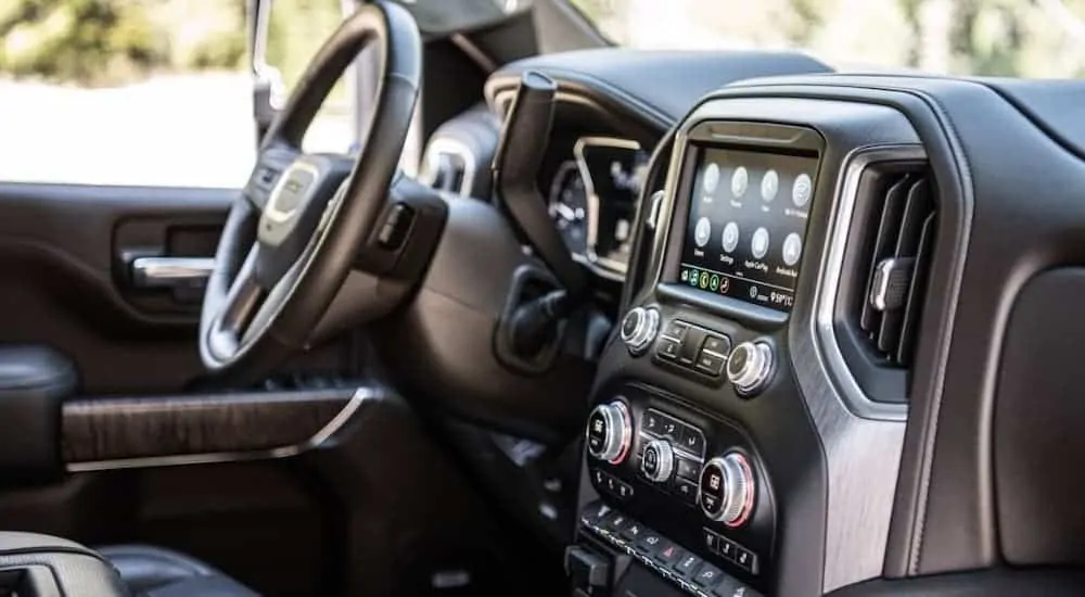 The dashboard and infotainment screen is shown in a 2020 GMC Sierra HD Denali.