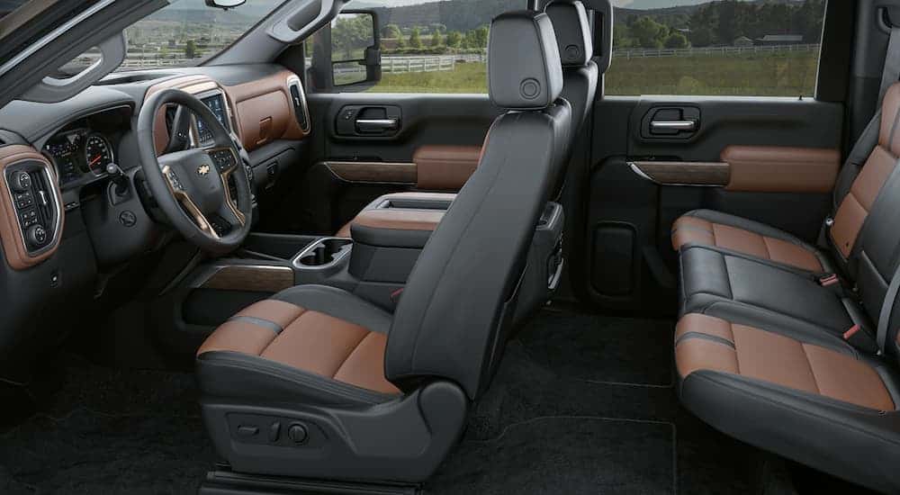 The brown and black interior of a 2020 Chevy Silverado 3500HD is shown.
