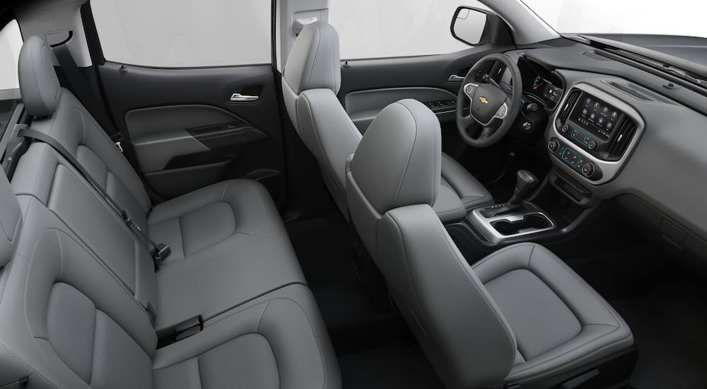 The grey interior of a 2020 Chevy Colorado LT is shown.