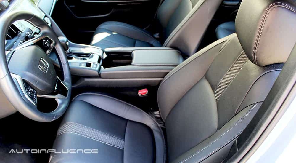 The black and grey interior of a 2020 Honda Civic Hatchback is shown.