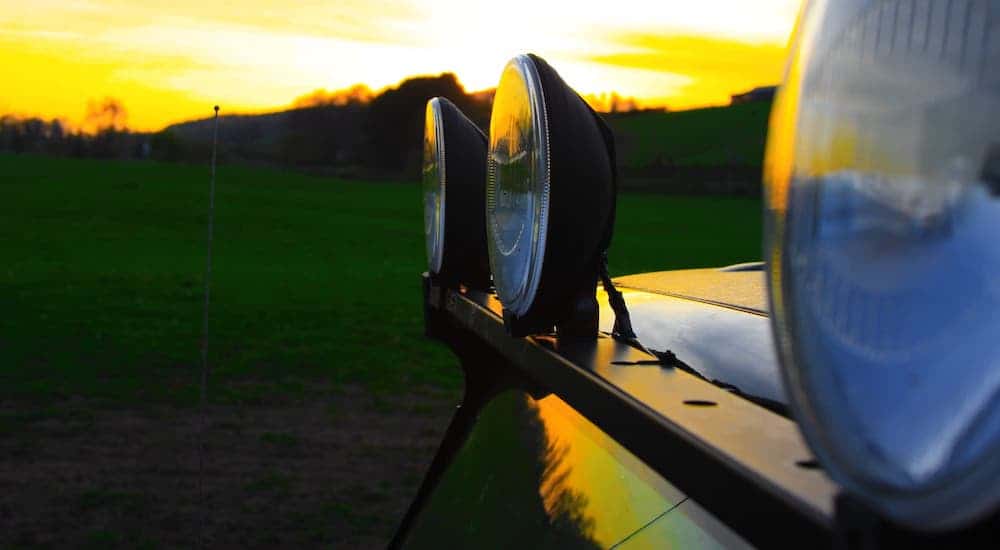 A closeup is shown of a light bar on a vehicle at sunset.