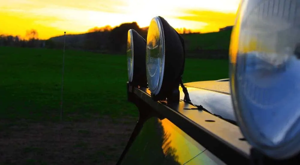 A closeup is shown of a light bar on a vehicle at sunset.