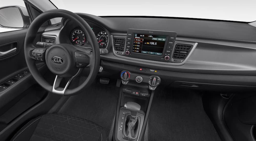 The black interior of a 2020 Kia Rio LX is shown.