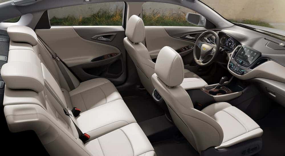 The white interior of a 2020 Chevy Malibu is shown from an above side angle.