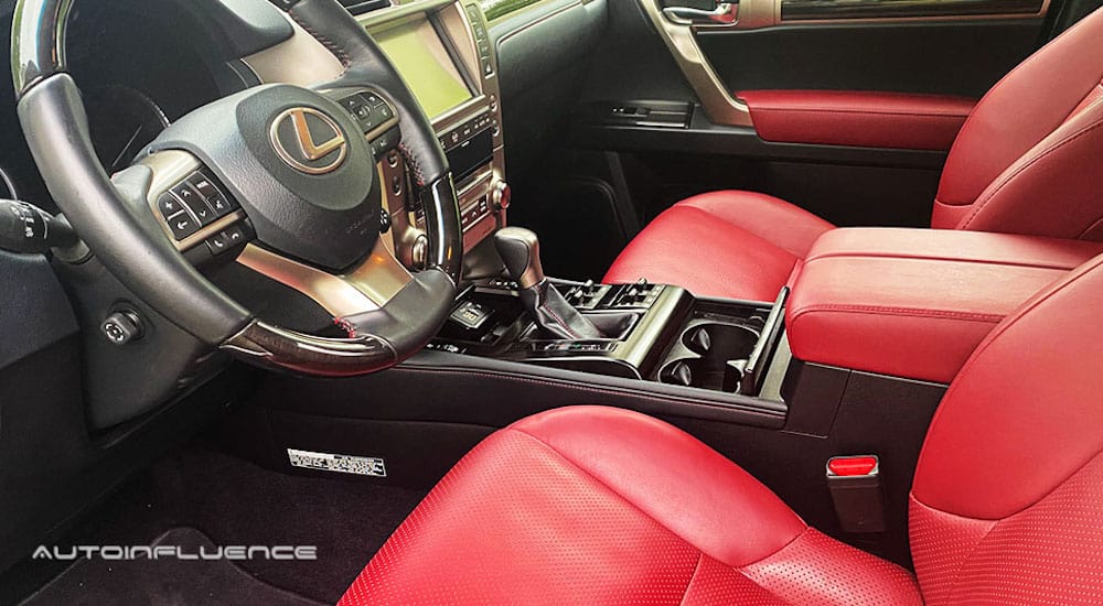 The interior of a 2020 Lexus GX 460 is shown with red seats.