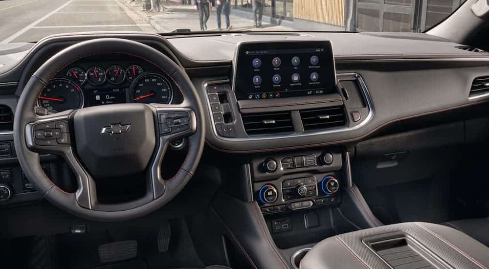 The steering wheel and infotainment screen in the 2021 Chevy Tahoe are shown.