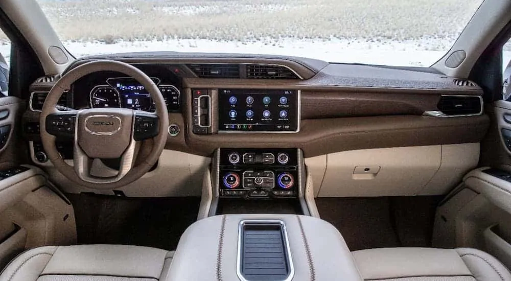 The updated brown and tan leather interior is shown in a 2021 GMC Yukon Denali.