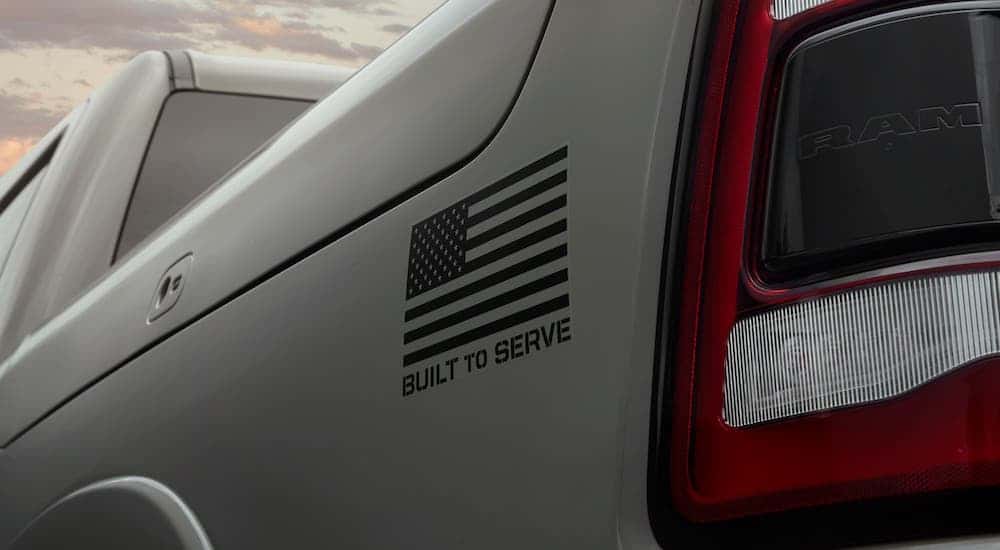 A closeup is shown of the badging on a gray 2020 Ram 1500 Built To Serve edition.