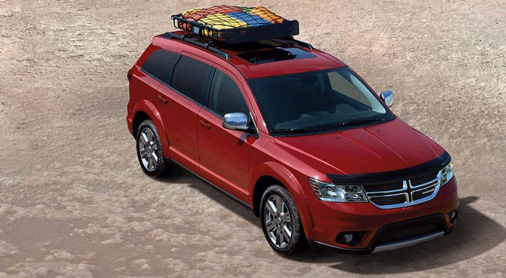 A red 2020 Dodge Durango, one of the worst SUVs of all time, is shown from above in the desert.