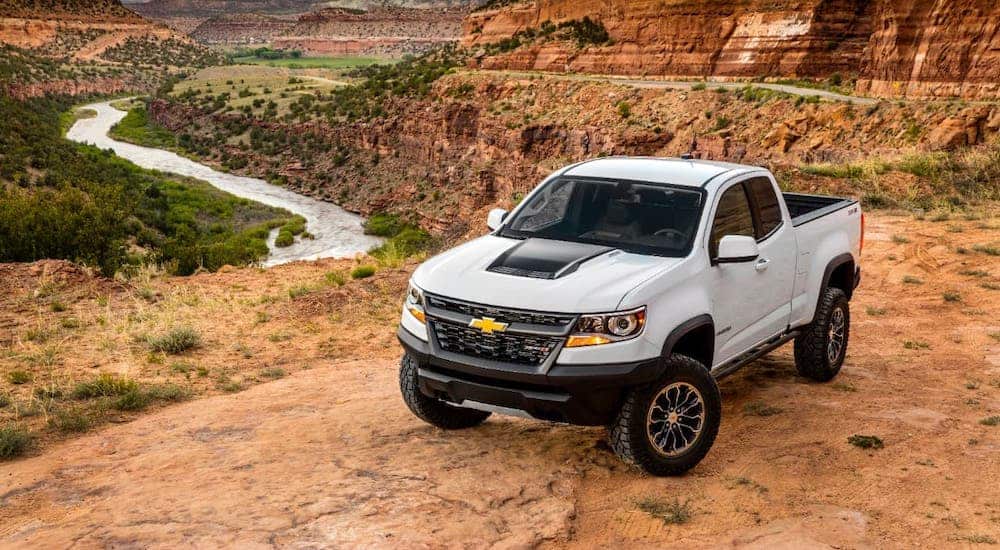 A white 2020 Chevy Colorado ZR2 is parked overlooking a canyon.