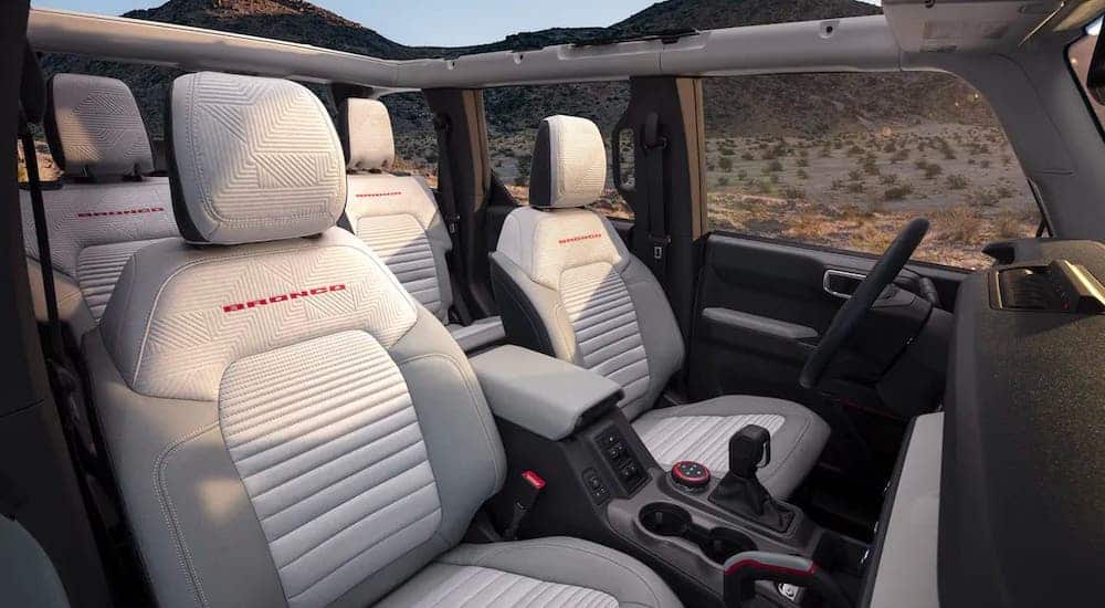 A white and gray interior of a 2021 Ford Bronco 4 door is shown.