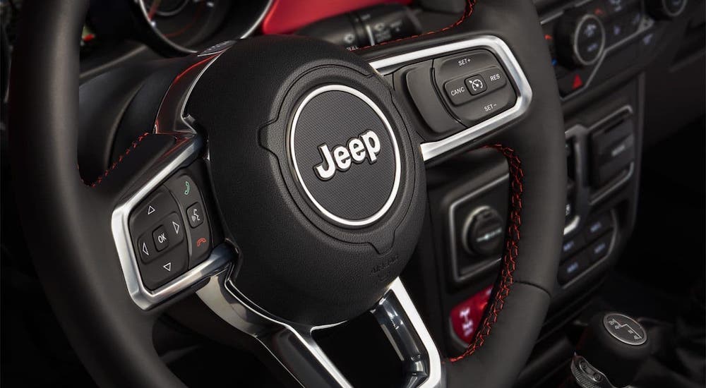 A closeup shows the steering wheel in a 2020 Jeep Wrangler at a Jeep dealership near you.