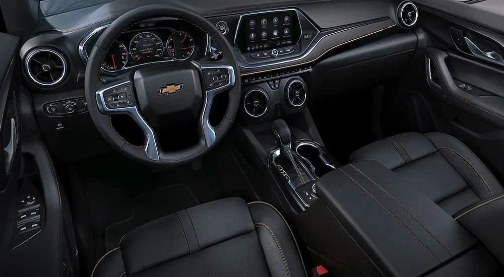 The black front seats and dashboard are shown in a 2020 Chevy Blazer.