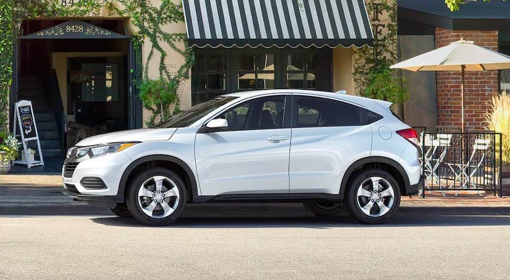 A white 2020 Honda HR-V is parked in front of a cafe after losing the 2020 Chevy Trax vs 2020 Honda HR-V comparison.