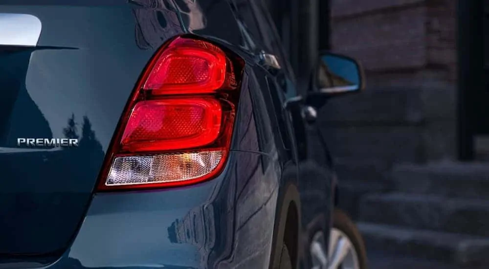 The rear badging of a blue 2020 Chevy Trax Premier is shown.