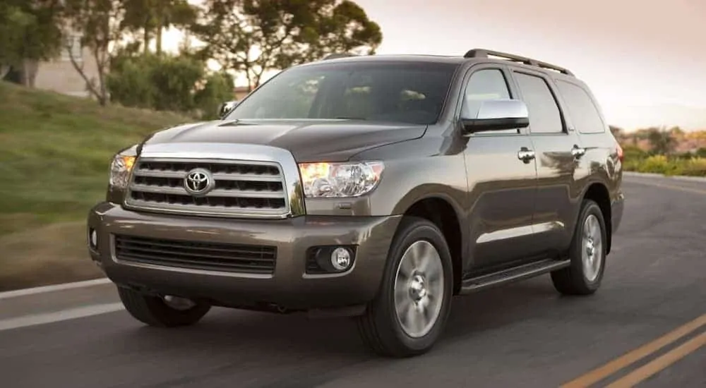 A gray 2017 Toyota Sequoia is driving on a highway.