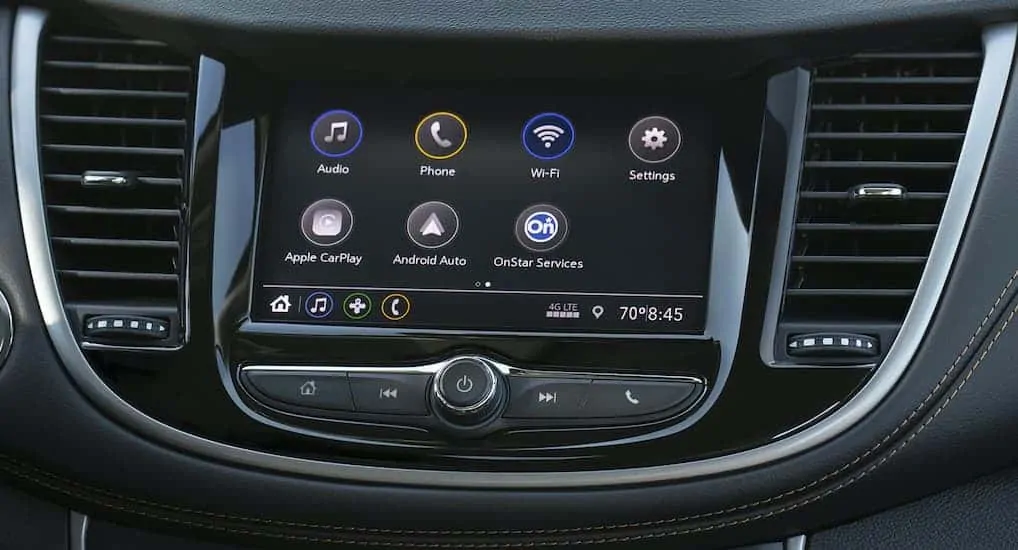 A close up view of the 2021 Chevorlet Trax is showing the infotainment system with multiple icons on it.