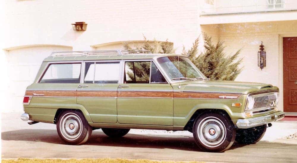 A green 1969 Jeep Wagoneer is shown in front of a home in Colorado Springs.