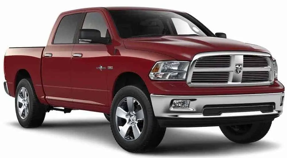 A red 2012 used Ram 1500 is shown with a white background.