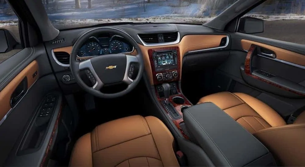 The black and tan interior of a 2016 used Chevy Traverse LTZ is shown.