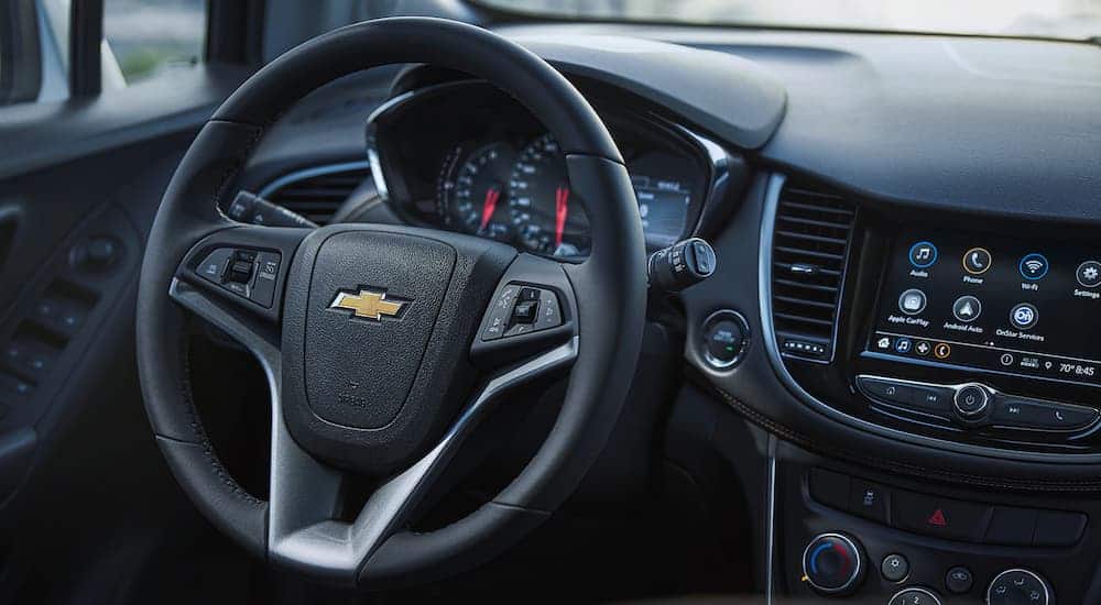 The black interior is shown on a 2021 Chevy Trax.