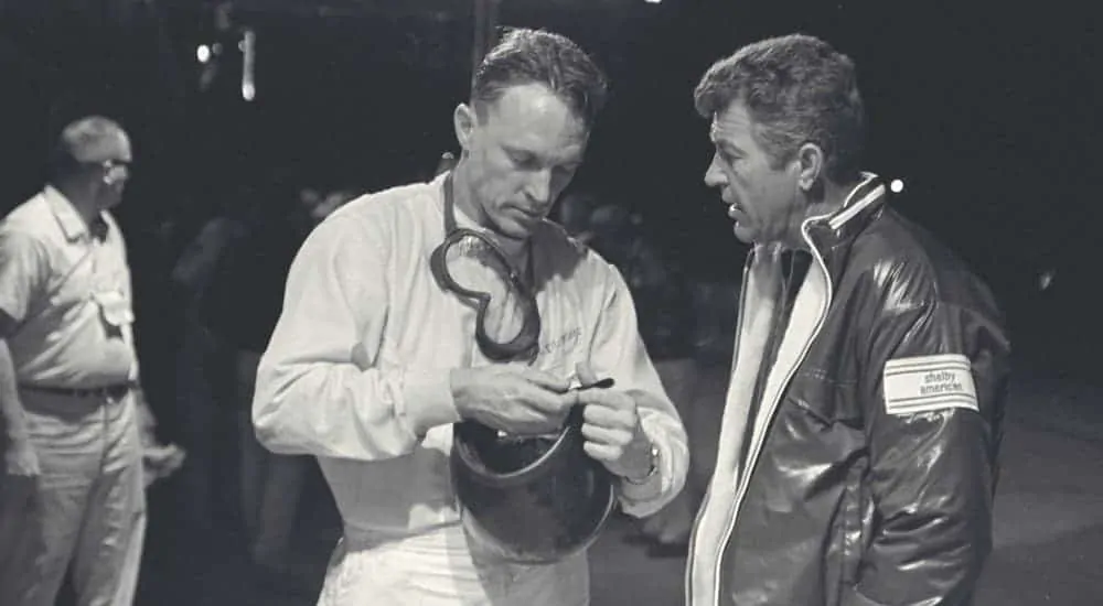 Dan Gurney and Carol Shelby are talking during the Sebring races in 1966.