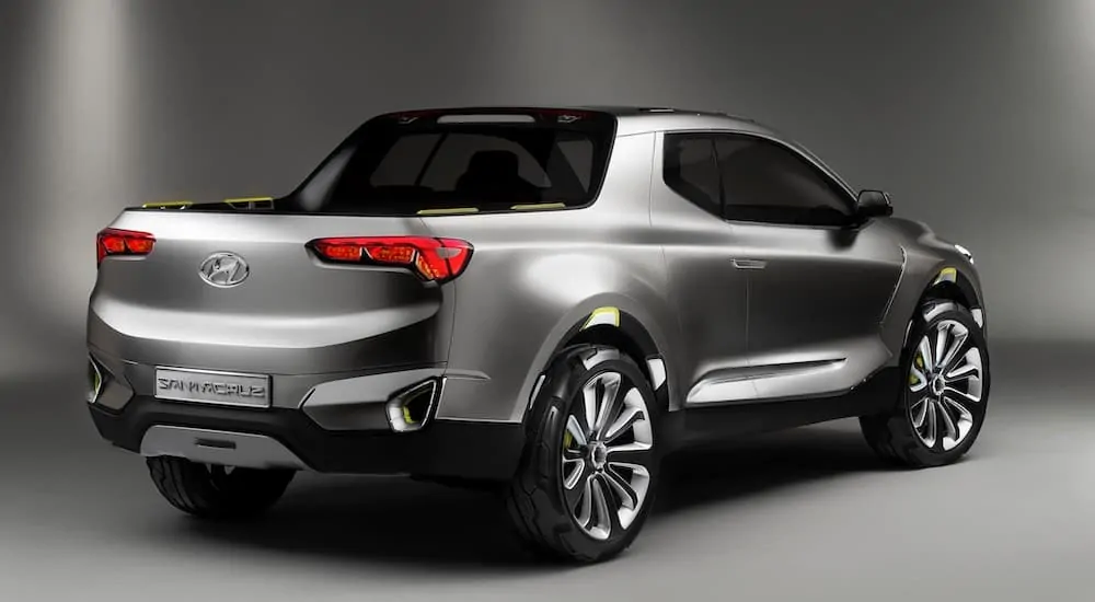 A silver 2021 Hyundai Santa Cruz is shown from the rear angled right.