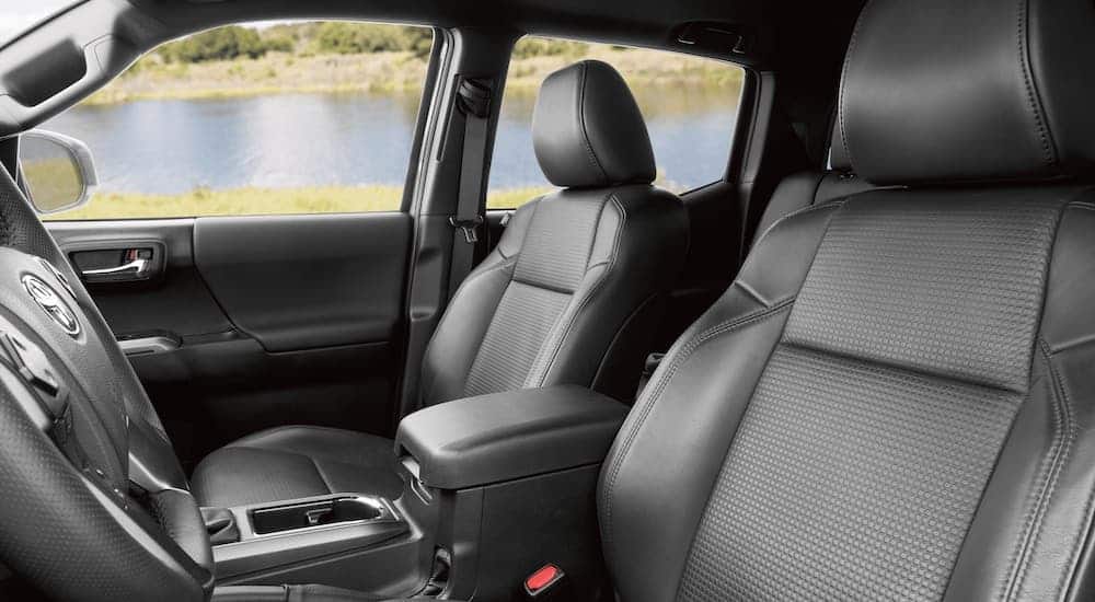 The black interior is shown on the 2021 Toyota Tacoma.