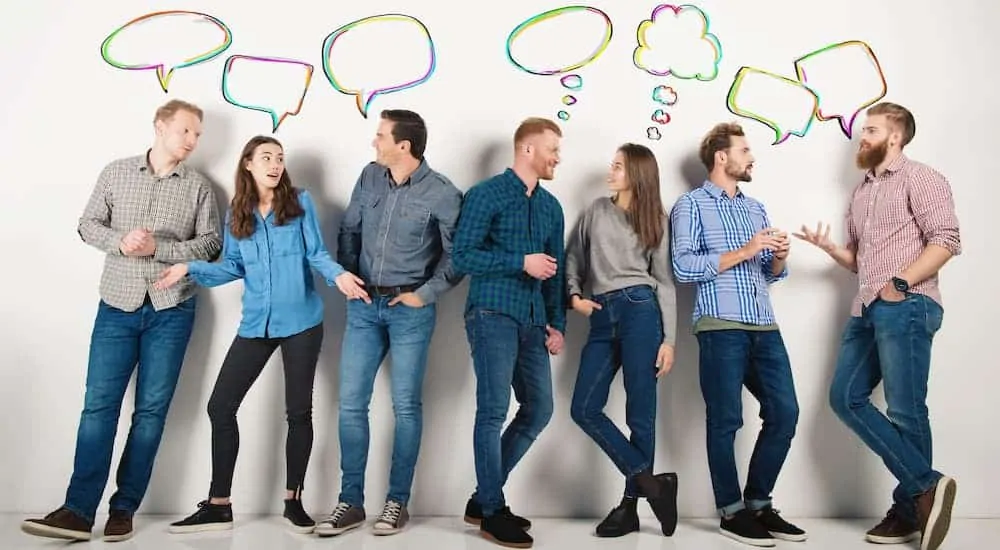 A group of people are shown speaking with empty word and thought bubbles above their heads.