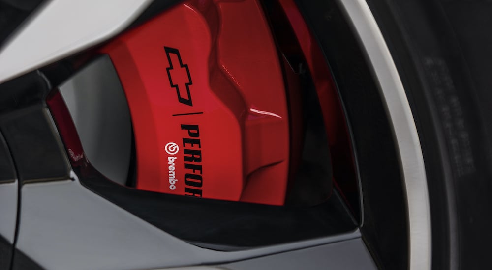 The red performance Brembo brakes are show in close up on a 2018 used Chevy Tahoe RST.