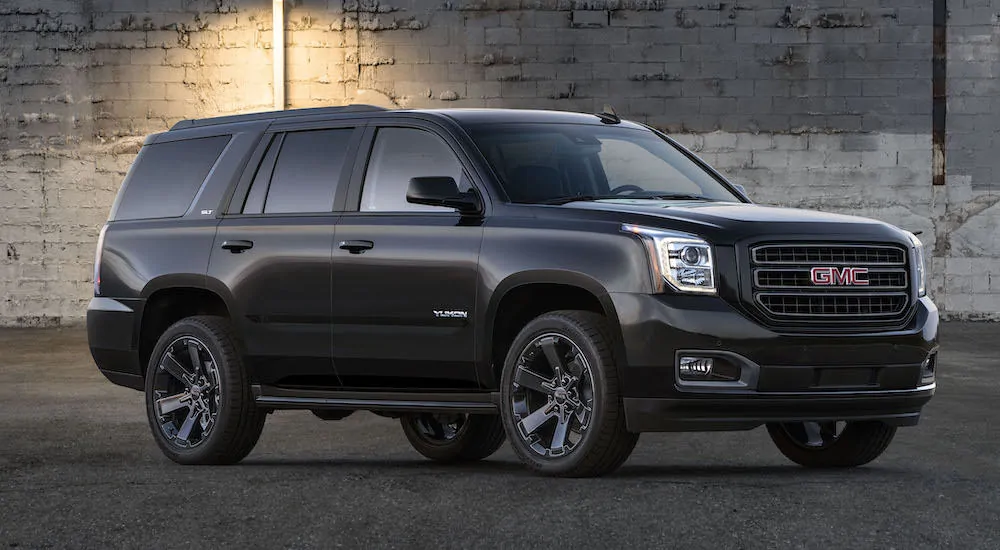 A black 2019 GMC Yukon Graphite Edition is parked under a street light.