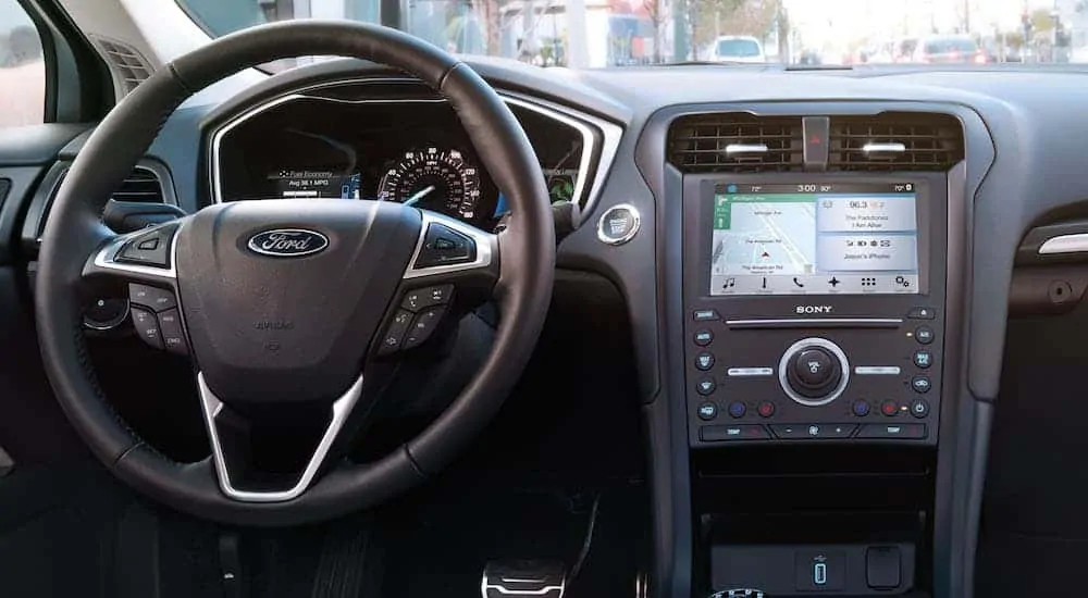 The black interior is shown on a 2017 used Ford Fusion Hybrid.