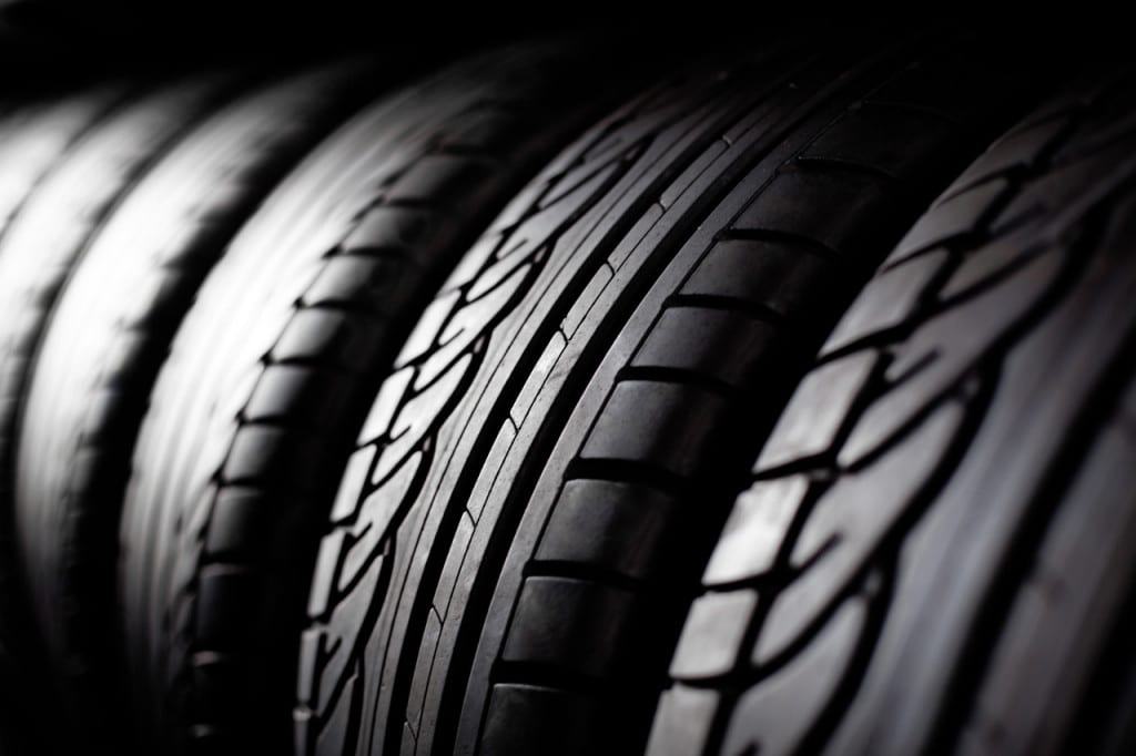 Tires are shown in closeup in black and white.