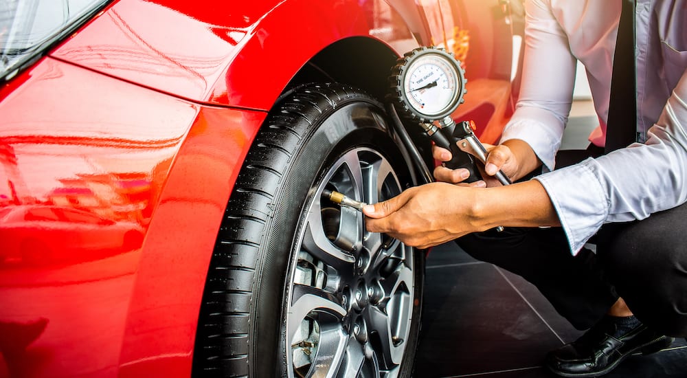 Tire having its pressure checked and air filled by driver
