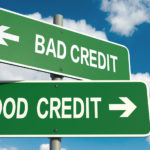 Two green signs facing in opposite directions, one saying "bad credit" the other, "good credit"