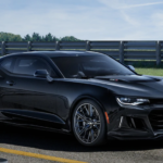 A black 2019 Chevrolet Camaro ZL1 is shown on a track.