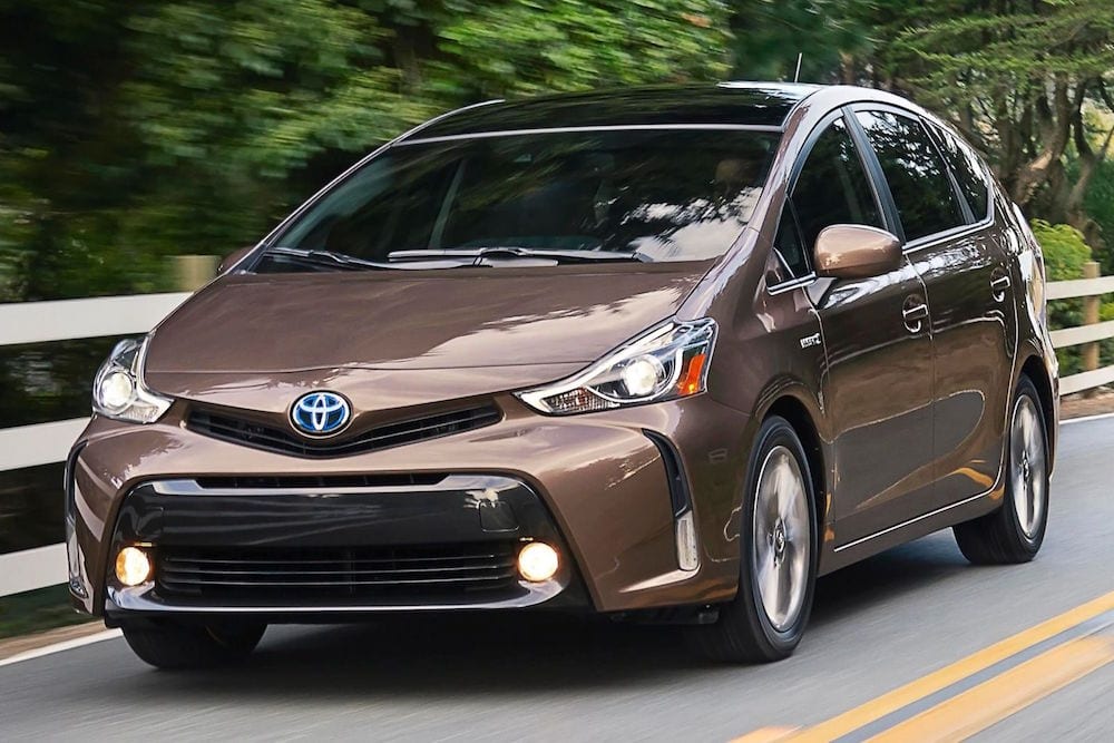 Maroon 2015 Toyota Prius Driving on the Road