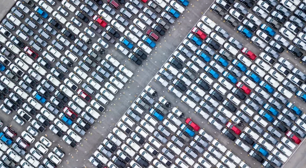 Aerial view of a jam-packed parking lot at a buy here, pay here dealership