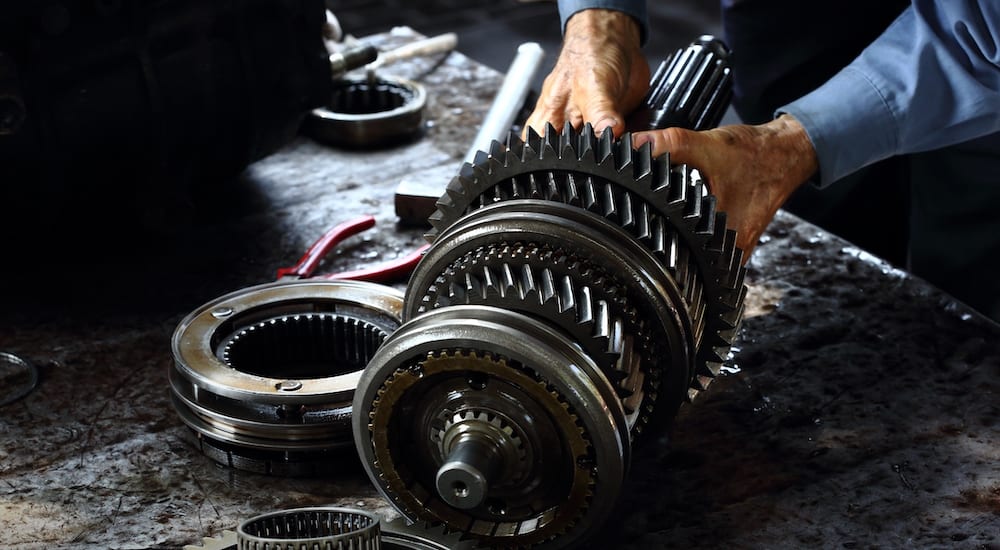 A mechanic handling a power transmission