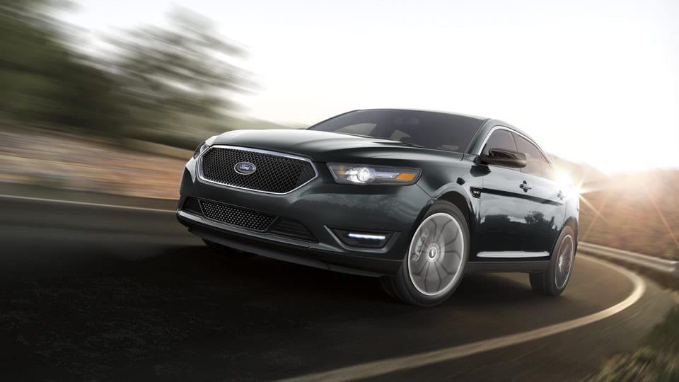 A black 2019 Ford Taurus SHO is shown from the front at an angle.