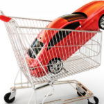Orange-red car in a silver and red shopping cart