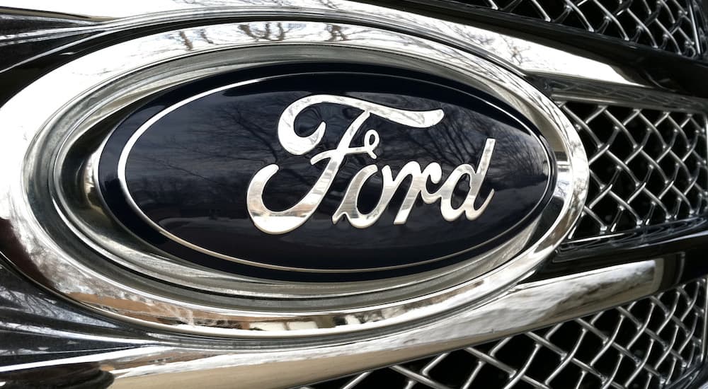 A proud black and white Ford logo on a grill