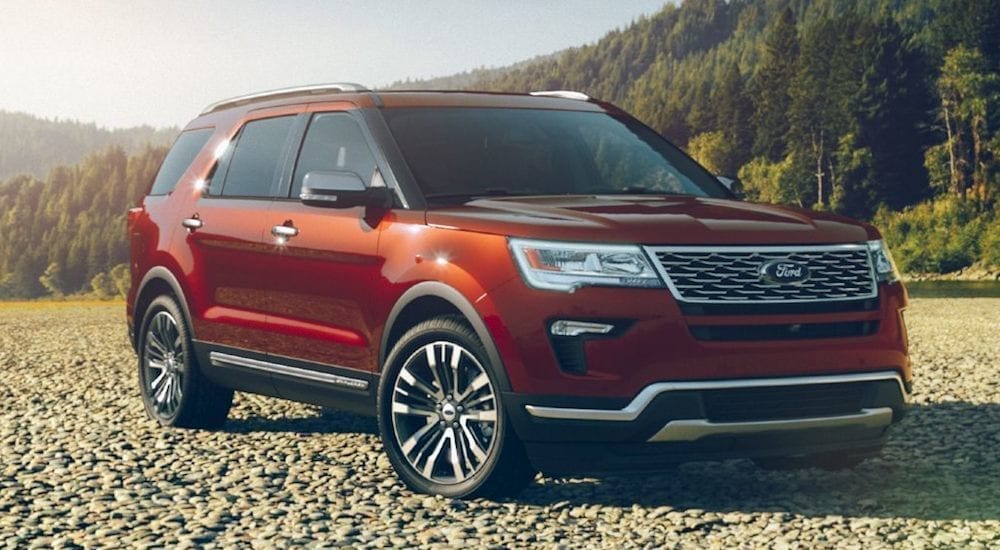 A red 2018 Ford Explorer parked in a field