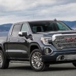 The 2019 GMC Sierra 1500 sits parked by a coastal highway