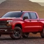 Red 2018 Chevy Silverado in front of canyon at sunset