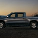 The brand new 2019 Chevy Silverado in front of a football filed at night