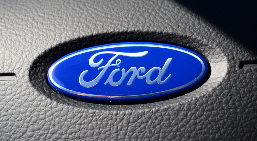 Closeup of the Ford logo on a steering wheel